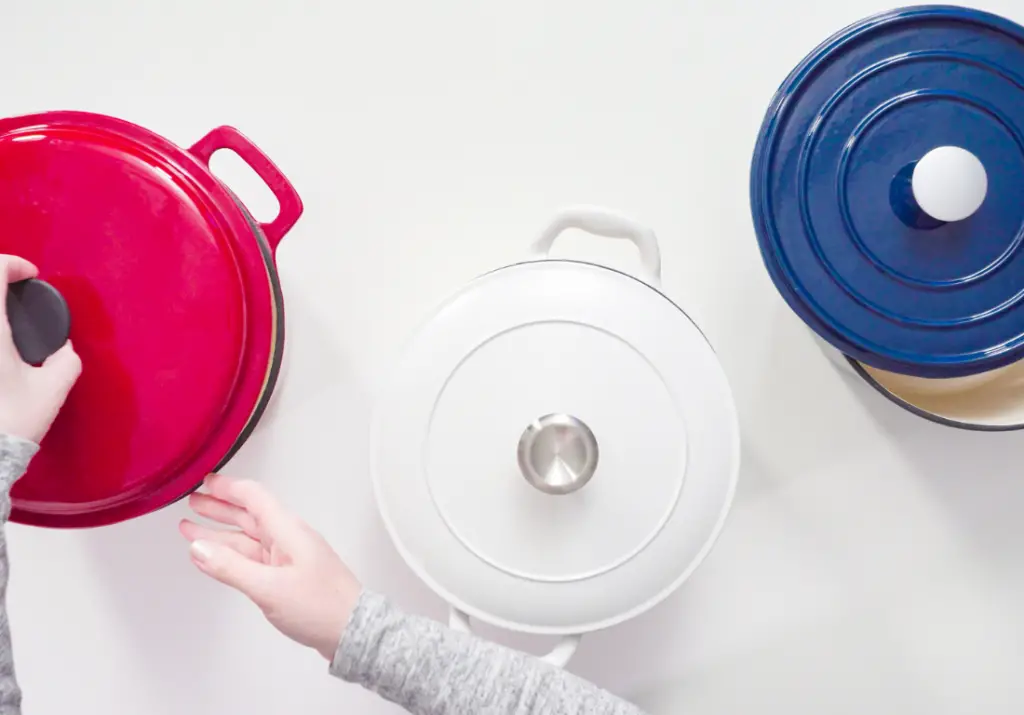How can I avoid scratching or chipping my enameled cookware?